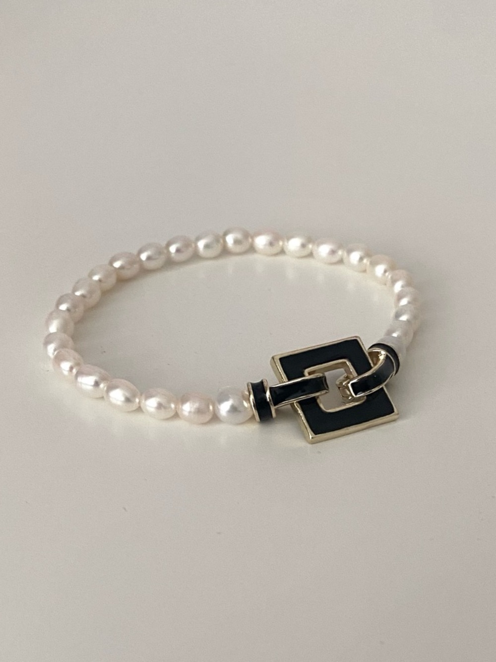 Pearl Bracelet with Black & Gold Square Charm Clasp